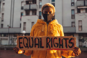 Young activist holding equal rights sign