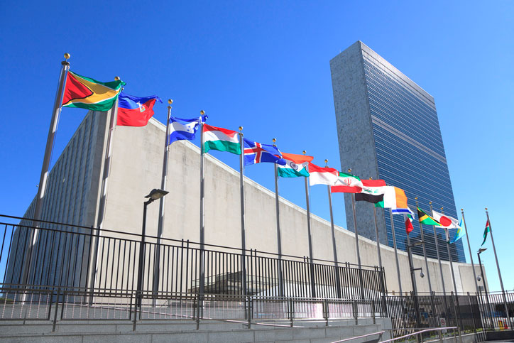 Outside United Nations headquarters with flags flying
