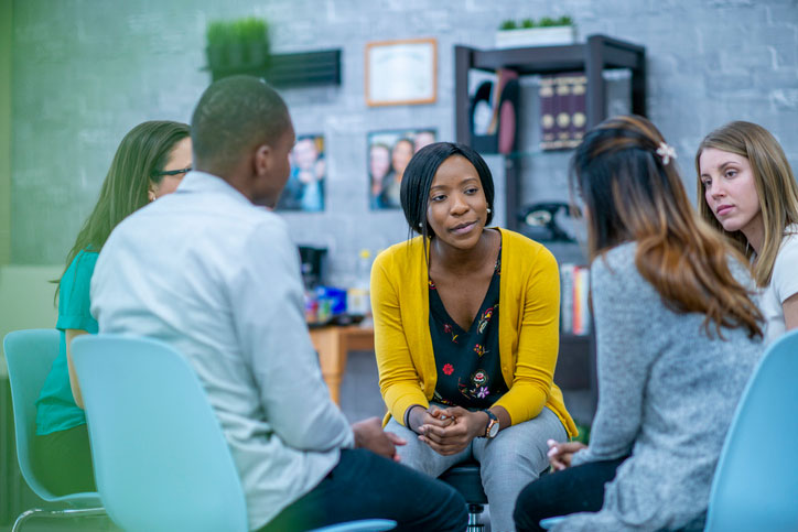 Adults in a group therapy session