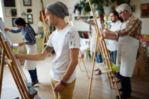 Artists painting in workshop