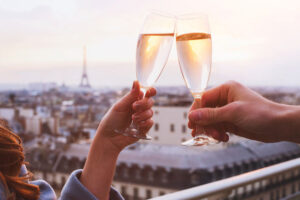 Couple drinking Champagne in Paris, France