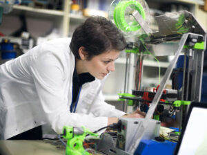 Female engineer using a 3D printer