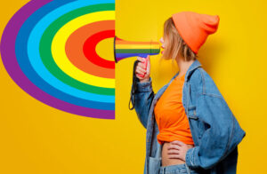 Girl yelling into rainbow megaphone