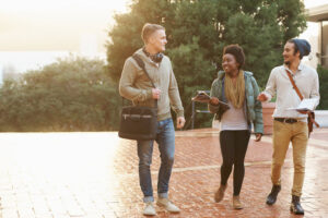 Group of students bonding, walking on campus together