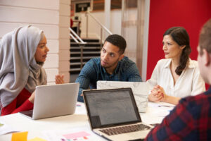 Small class students meeting with teacher