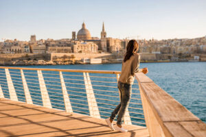 Woman viewing Valletta Malta city skyline