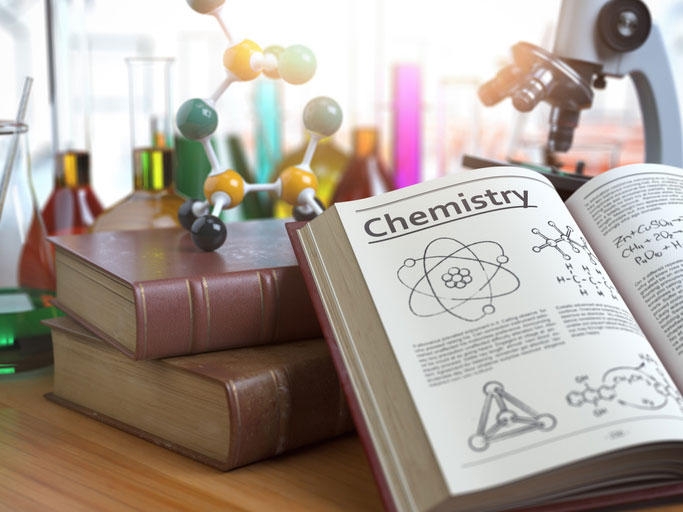 Chemistry book open on table