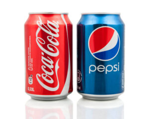 Coca-Cola and Pepsi cans side by side