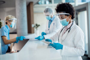 Doctor on tablet in hospital