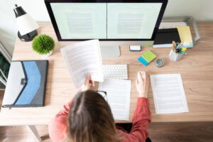 Female translator working at computer