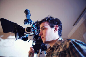 Filmmaker behind the camera during documentary 
