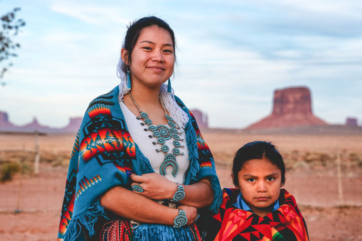 Navajo brother and sister in desert