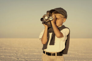 Young filmmaker in desert