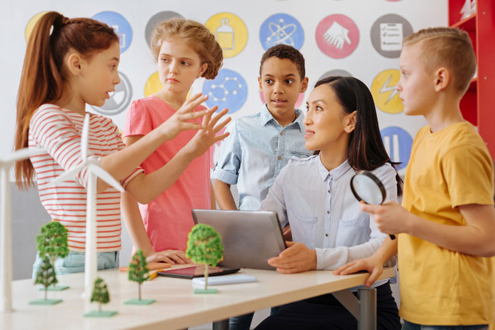 Teacher on the job with students in classroom